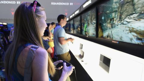 A visitor to this year's Electronic Entertainment Expo in Los Angeles plays a demo of "Warframe" at the Sony Playstation 4 booth.