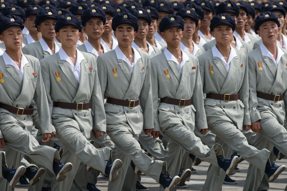 North Korean soldiers march through Kim Il-Sung square during a military parade. Forming perfect straight lines of people is not limited to the military. The training begins at a young age and by the time they are in their teens a crowd of hundreds can organize themselves into any number of parallel lines, equally spaced, in a minute. 