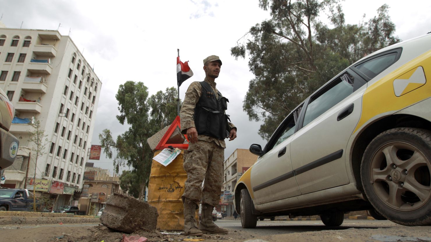 A Yemeni policeman stands at a checkpoint in Sanaa on August 3, 2013, after terror threats closed Western embassies. 
