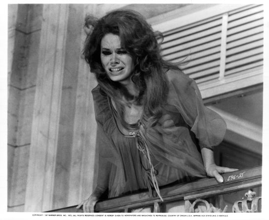 Black leans over a balcony in "Portnoy's Complaint" in 1972.