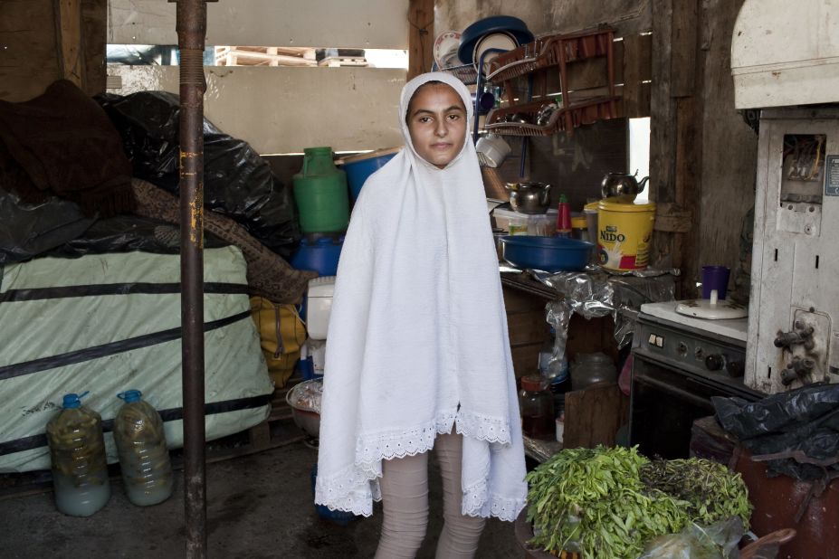 Syrian refugee, Mona, 14, lives with her parents and five younger siblings in Beirut, Lebanon. Mona says that her family decided to flee Syria the day their neighbor was killed in front of their house. She and her extended family of over 40 people now live in two makeshift buildings in Beirut. The food they ate for iftar comes mostly from charity.