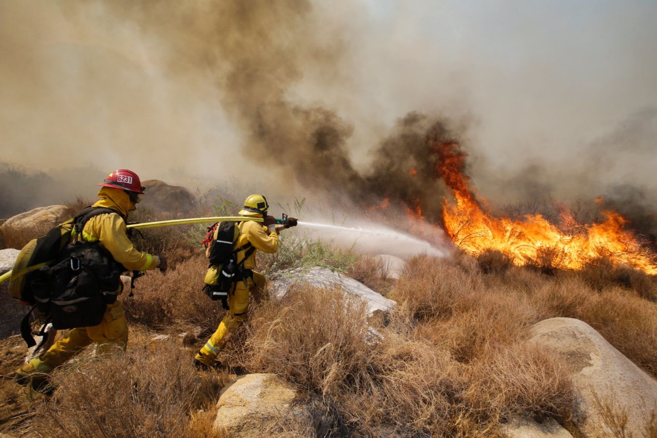 AUGUST 9 - CABAZON, CALIFORNIA: Firefighters battle a <a href="http://cnn.com/2013/08/08/us/california-wildfire/index.html">wildfire in Southern California mountains</a>. The fast-spreading fire forced 1,500 people to flee their homes. Researchers warn that deforestation, climate change and lack of fire protection can lead to <a href="http://cnn.com/2012/07/03/us/western-wildfires-why">more frequent and bigger wildfires</a>.