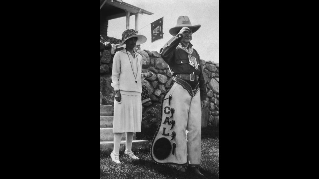 President Calvin Coolidge poses in personalized chaps with his wife, Grace, at a party in South Dakota in 1927. The party celebrated the Fourth of July as well as Coolidge's 55th birthday.