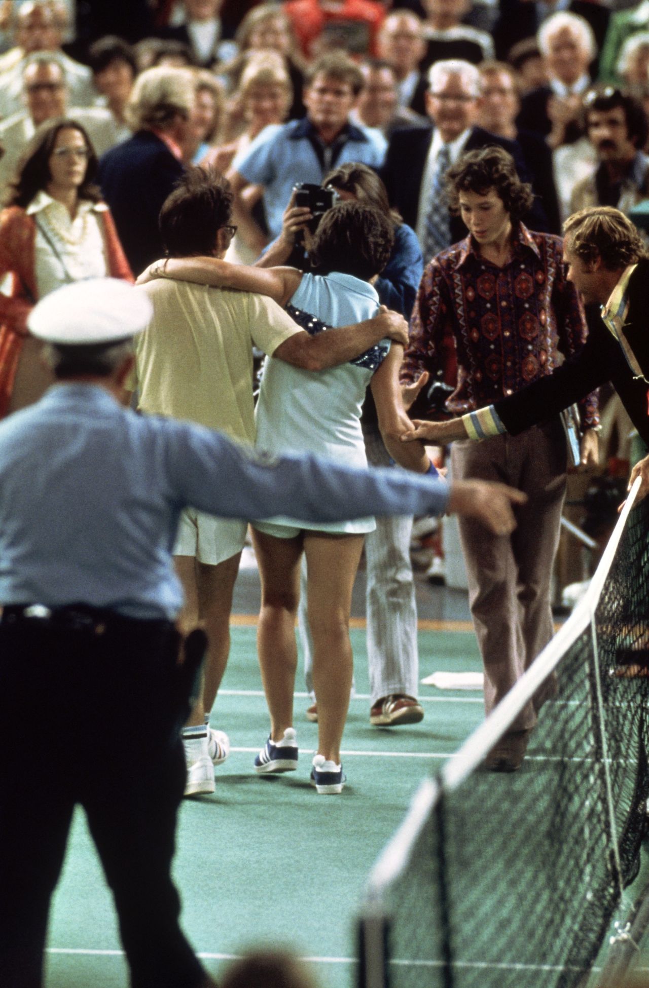 Riggs and King embrace after the famous encounter in 1973. King won the match in straight sets. 