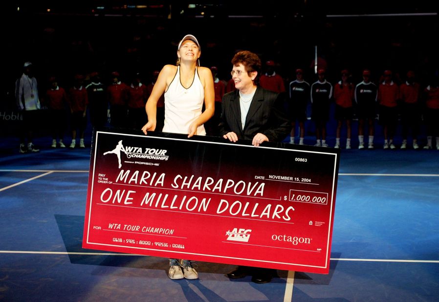 King presents Maria Sharapova with a check for $1 million after the Russian superstar won the WTA Championships in 2004 --  beating Serena Wiliams in the final.