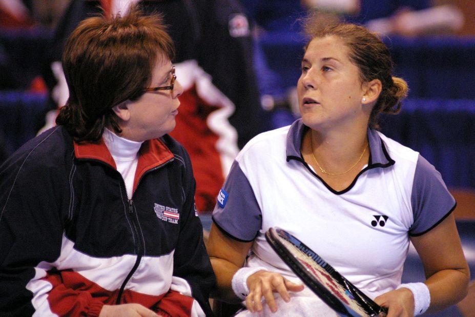 King, in her role as captain of the United States Fed Cup team, gives a pep talk to Monica Seles during a 2000 tie against Belgium.