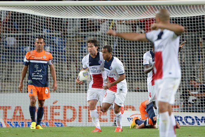 Maxwell picks up the ball after scoring PSG's equalizer in their first Ligue 1 match of the season at Montepellier.