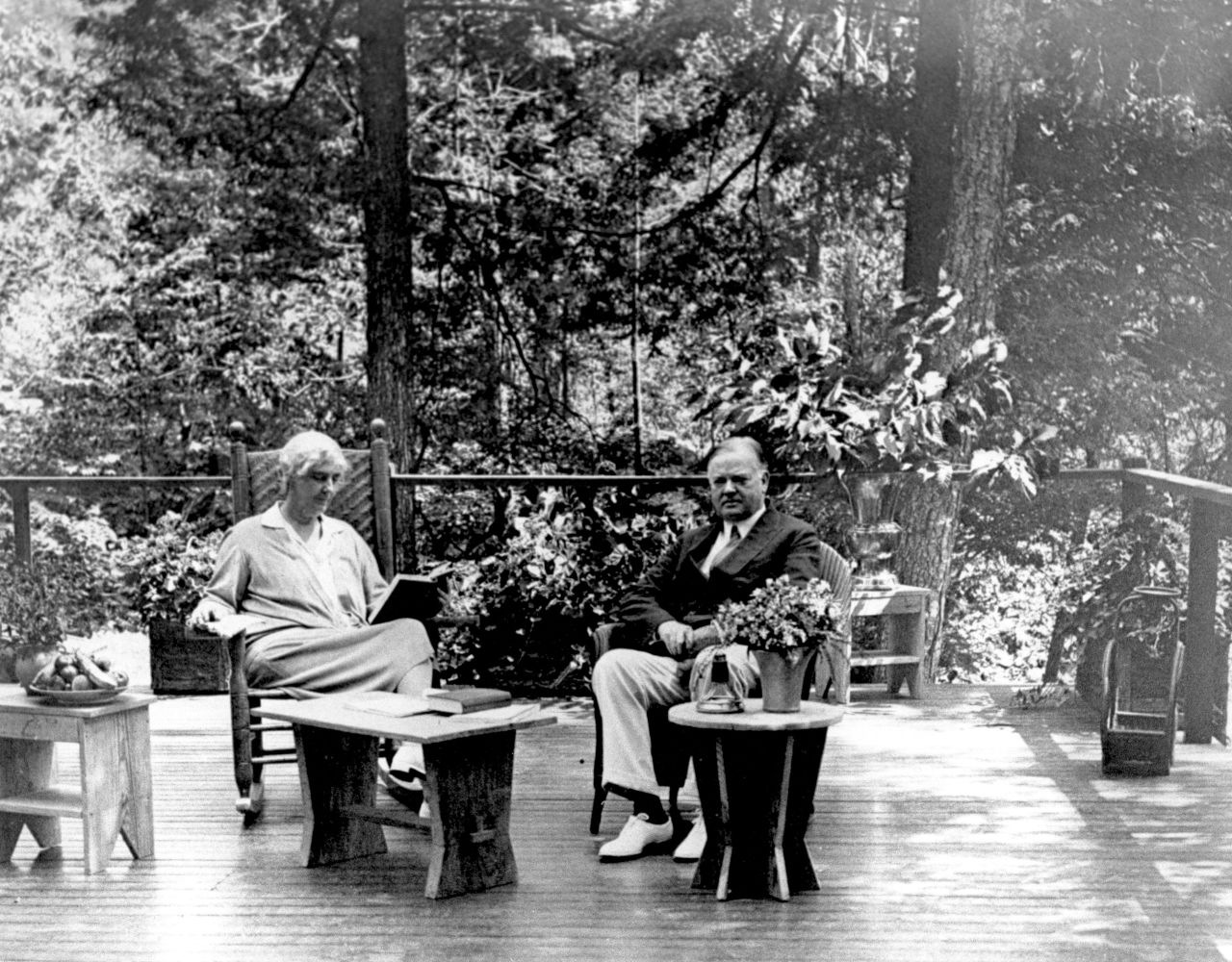 President Herbert Hoover and his wife, Lou Henry, sit on the porch of their Radipan Camp retreat, which is now part of the Shenandoah National Park in Virginia. Hoover originally bought the land for the vacation spot in 1929. 