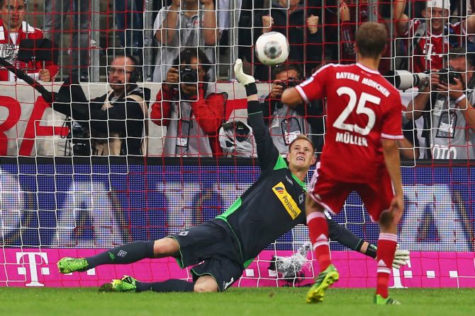 Goalkeeper Marc-Andre ter Stegen of Moenchengladbach saves a penalty from Thomas Mueller of Bayern Munich.