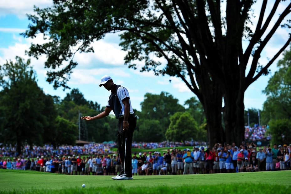 Tiger Woods reacts after missing a shot at the fourth hole. Woods won the last of his 14 majors in 2008 and the drought is set to continue after his struggles in the third round. 