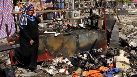 A woman inspects the aftermath of a car bomb attack on a store in Baghdad on Sunday, August 11. <a href="http://www.cnn.com/2013/08/10/world/meast/iraq-violence/index.html">Bloodshed erupted Saturday throughout Iraq</a> as dozens were killed and more than 190 wounded in a wave of bombings amid Eid festivities, which mark the end of the holy month of Ramadan.