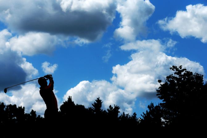 Tiger Woods watches his drive on the fourth hole. Woods began the final round earlier than he would have wanted, well off the pace heading into Sunday. 