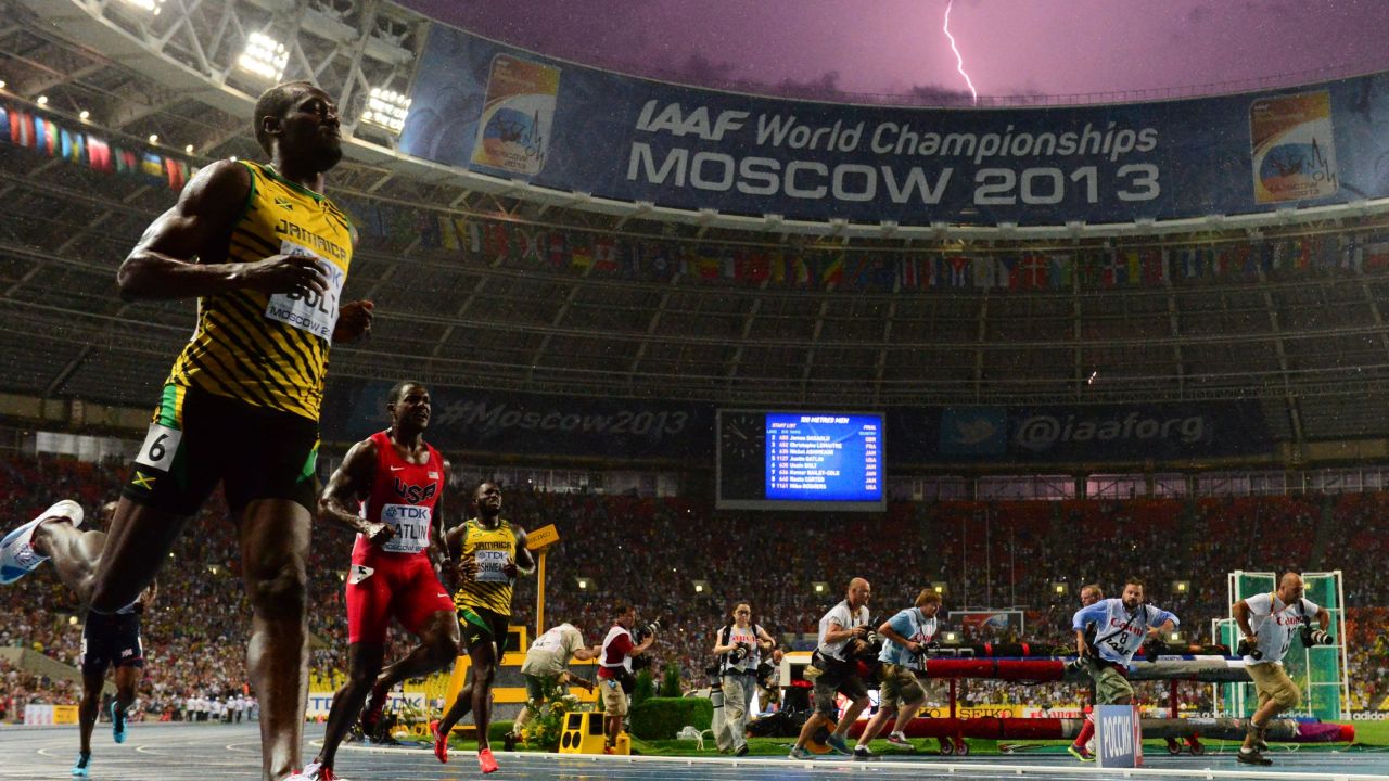 Lighting strikes as Jamaica's Usain Bolt wins the 100 meter final at the Moscow World Championships in Moscow on Sunday.