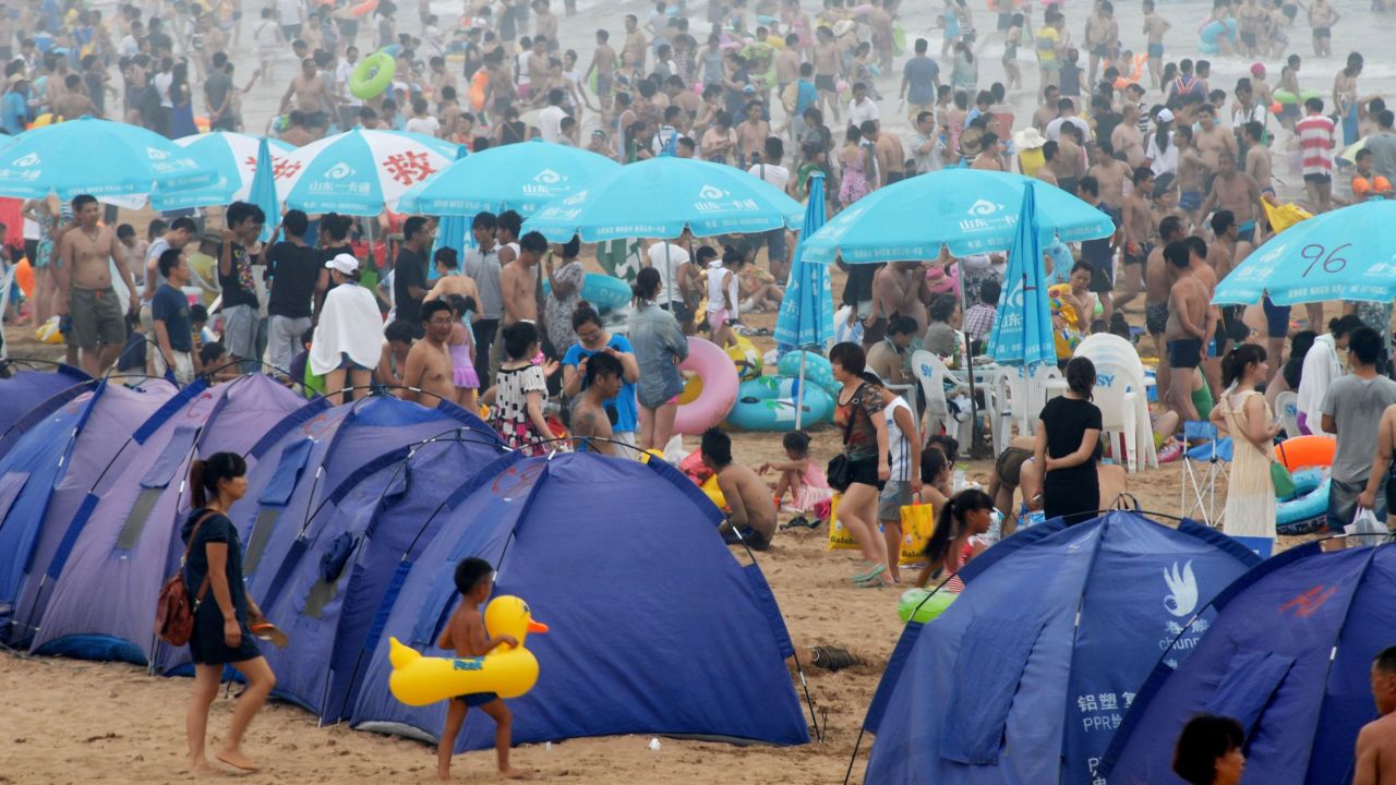 People flock to the beach in Qingdao, China, on Sunday, August 11.
