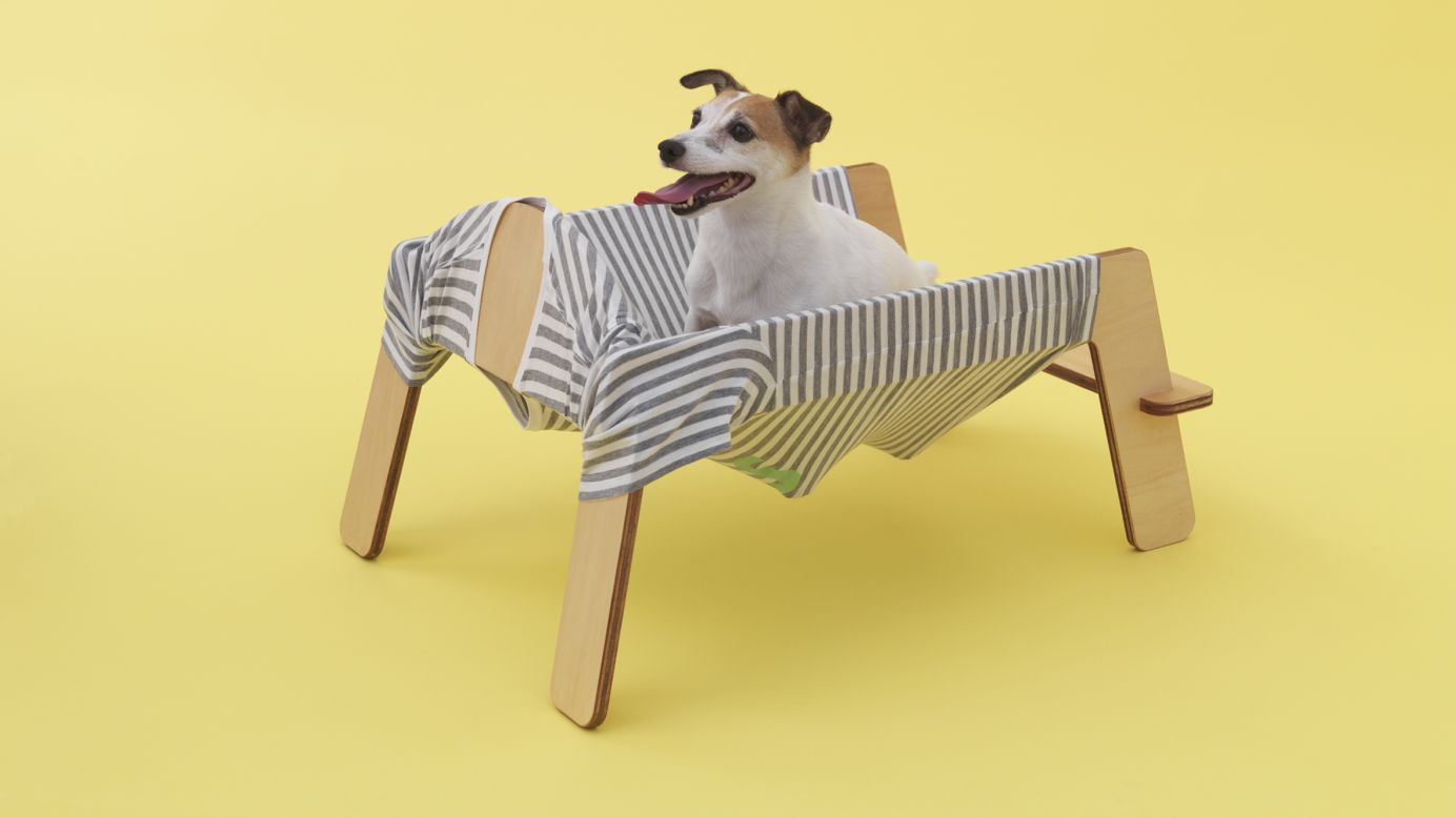 Torafu Architects designed "Wanmock," a playful combination of a hammock and a dog bark (the sound is "wan" in Japanese) for the energetic Jack Russell terrier. The frame is in the shape of a standing dog, and the fabric is the shape of a dog shirt.