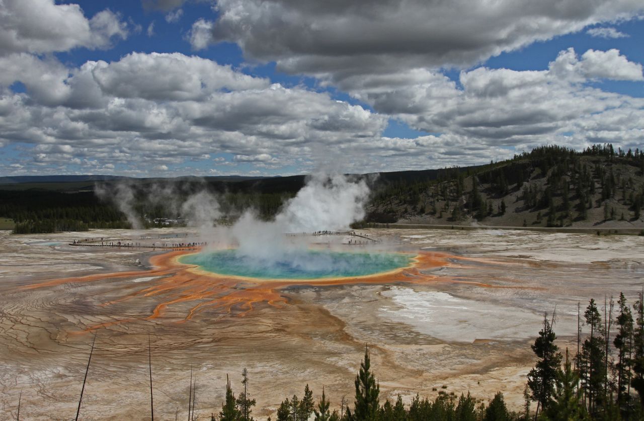 Grand Prismatic Spring is Hottle's favorite spring in the park, and it's in Midway Geyser Basin about five miles from Old Faithful. When the light is right, hike up one of the mountains surrounding the spring and you'll see the steam change colors because of the spring's bacteria.