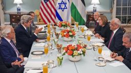   US Secretary of State John Kerry (center-L) hosts dinner for the Middle East Peace Process Talks, at the Department of State with Israeli Mr. Isaac Molho (right rear) , Israeli Justice Minister Tzipi Livni (right 2nd from end) and Palestinian chief negotiator Saeb Erekat (3rd), and Palestanian Dr. Shtayyeh (lower right corner) in the Thomas Jefferson Room of the US Department of State July 29, 2013, in Washington, DC 