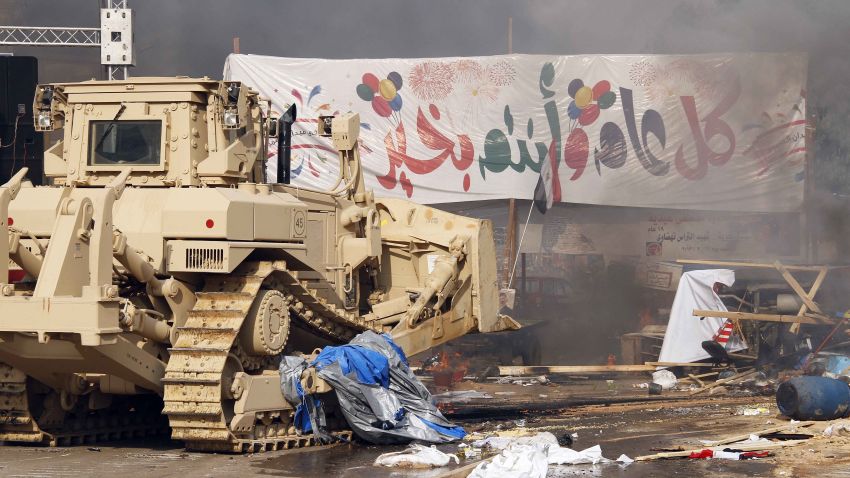 Egyptian security forces' bulldozers moved in to disperse a protest camp held by supporters of ousted president Mohamed Morsi and members of the Muslim Brotherhood, on August 14, 2013 near Cairo's Rabaa al-Adawiya mosque. Egypt's Muslim Brotherhood said at least 250 people were killed and over 5,000 injured in a police crackdown.