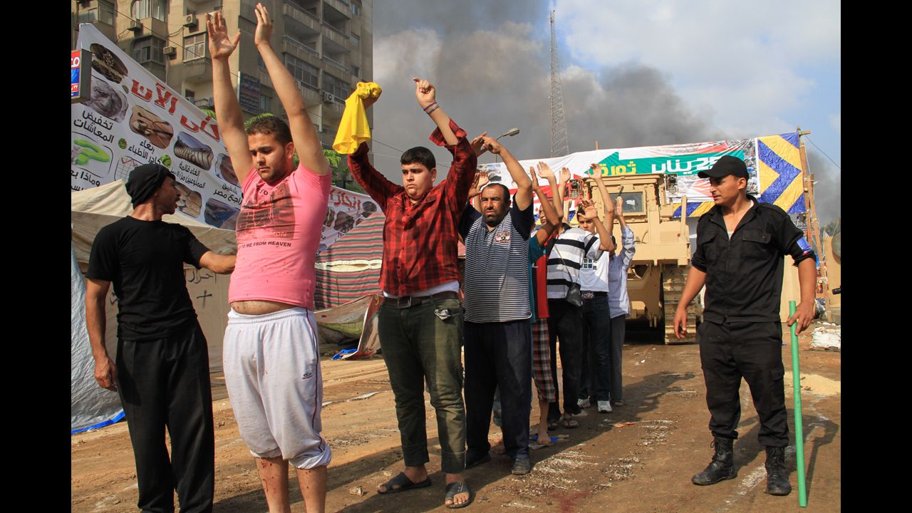 Egyptian security forces detain protesters in Cairo's Nasr City district on August 14, 2013.