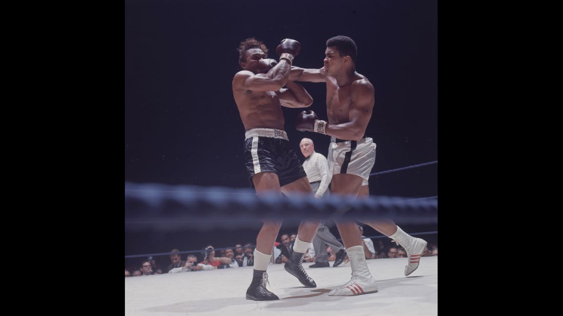Legendary boxer Muhammad Ali, right, faces Cleveland Williams on November 14, 1966. Ali successfully defended his title as the world heavyweight champion. 