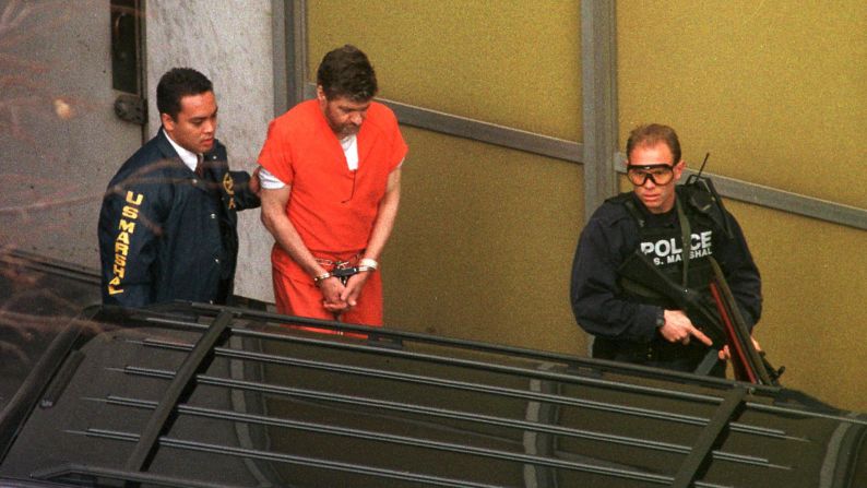 Kaczynski is escorted by U.S. marshals outside the federal courthouse in Sacramento on January 8, 1998.