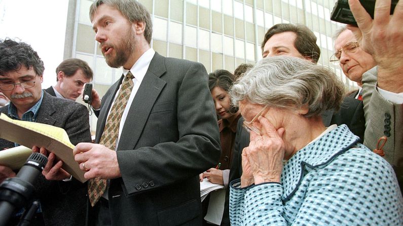 David Kaczynski, brother of Ted Kaczynski, speaks to the media as his mother Wanda wipes away tears after Ted Kaczynski admitted he was the Unabomber, pleading guilty to all counts on January 22, 1998, in Sacramento.