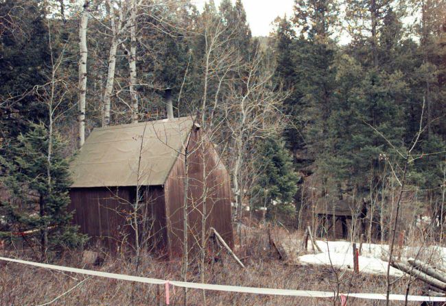 White plastic tape surrounds Kaczynski's cabin, hidden in a wooded area about 300 yards from the nearest neighbor in Lincoln, Montana, in April 1996. The cabin was put on display at the Newseum in Washington in 2008.