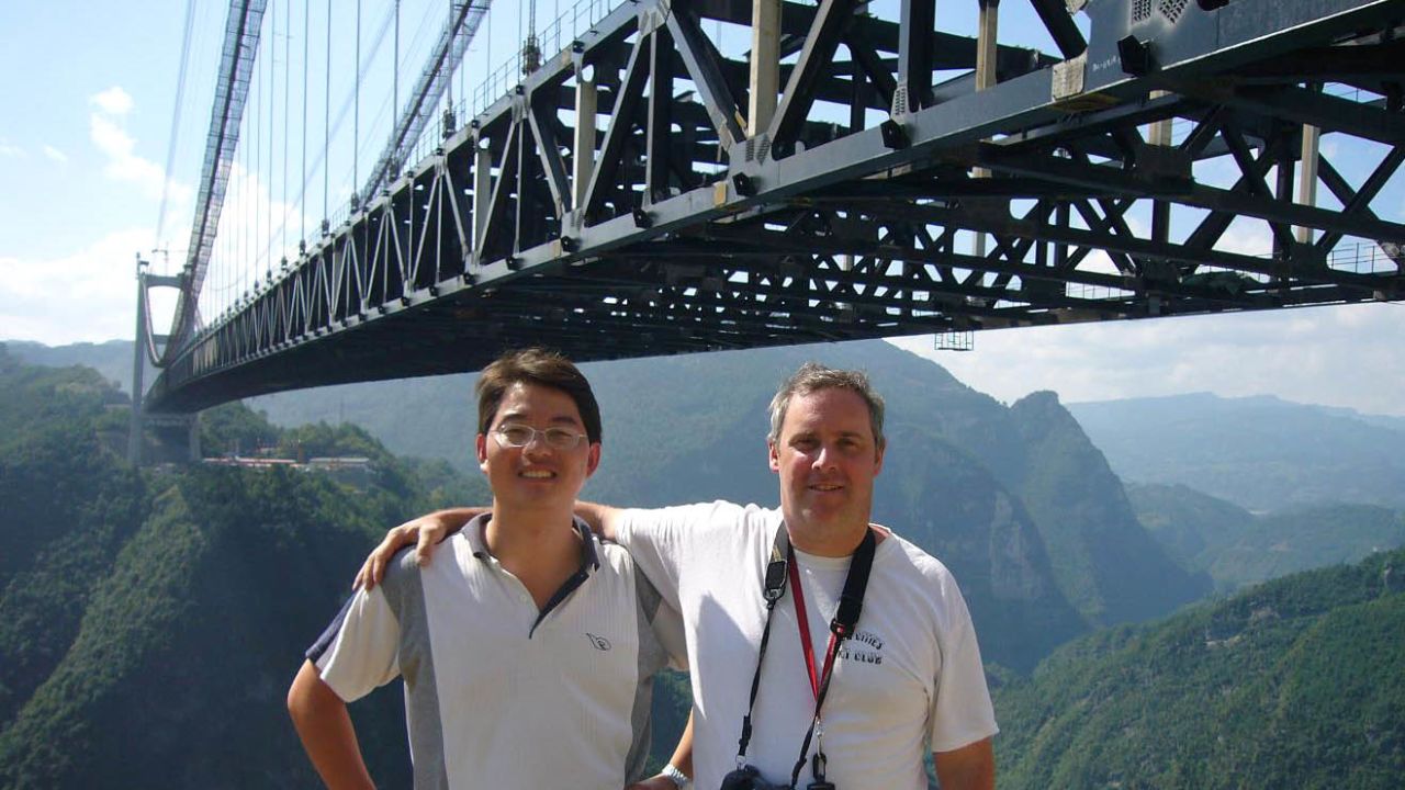 Eric Sakowski, right, and Chinese bridge engineer Shijie Du, at China's Sidhue River Bridge, the world's highest.
