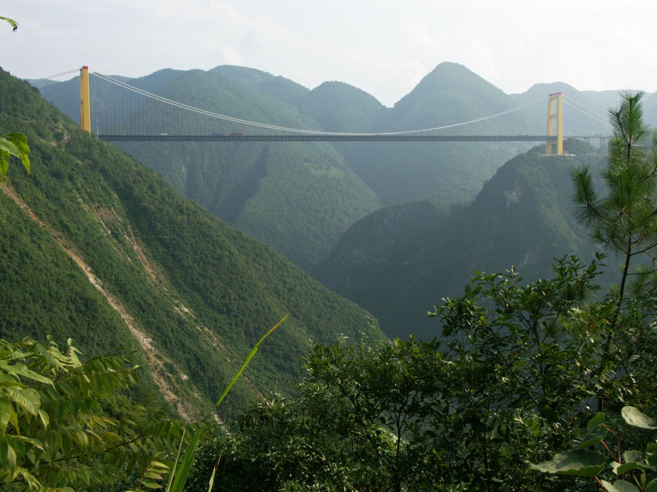 This is the highest bridge in the world. The Sidhue River Bridge hangs 1,627 feet (496 meters) above the water, according to highestbridges.com. It's located in China's Hubei Province, about 50 miles (80 kilometers) south of the well-known Yangtze River area called Three Gorges.