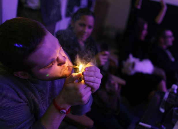 A man smokes a joint during the official opening night of Club 64, a marijuana social club in Denver, on New Year's Eve 2012. Voters in <a href="index.php?page=&url=http%3A%2F%2Fwww.cnn.com%2F2012%2F11%2F07%2Fpolitics%2Fmarijuana-legalization%2Findex.html">Colorado and Washington state</a> passed referendums to legalize recreational marijuana on November 6, 2012.