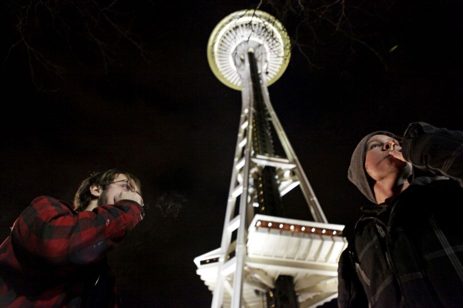 People light up near the Space Needle in Seattle after the law legalizing the recreational use of marijuana went into effect in Washington on December 6, 2012.