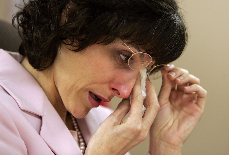 Medicinal marijuana patient Angel Raich wipes her eyes during a p