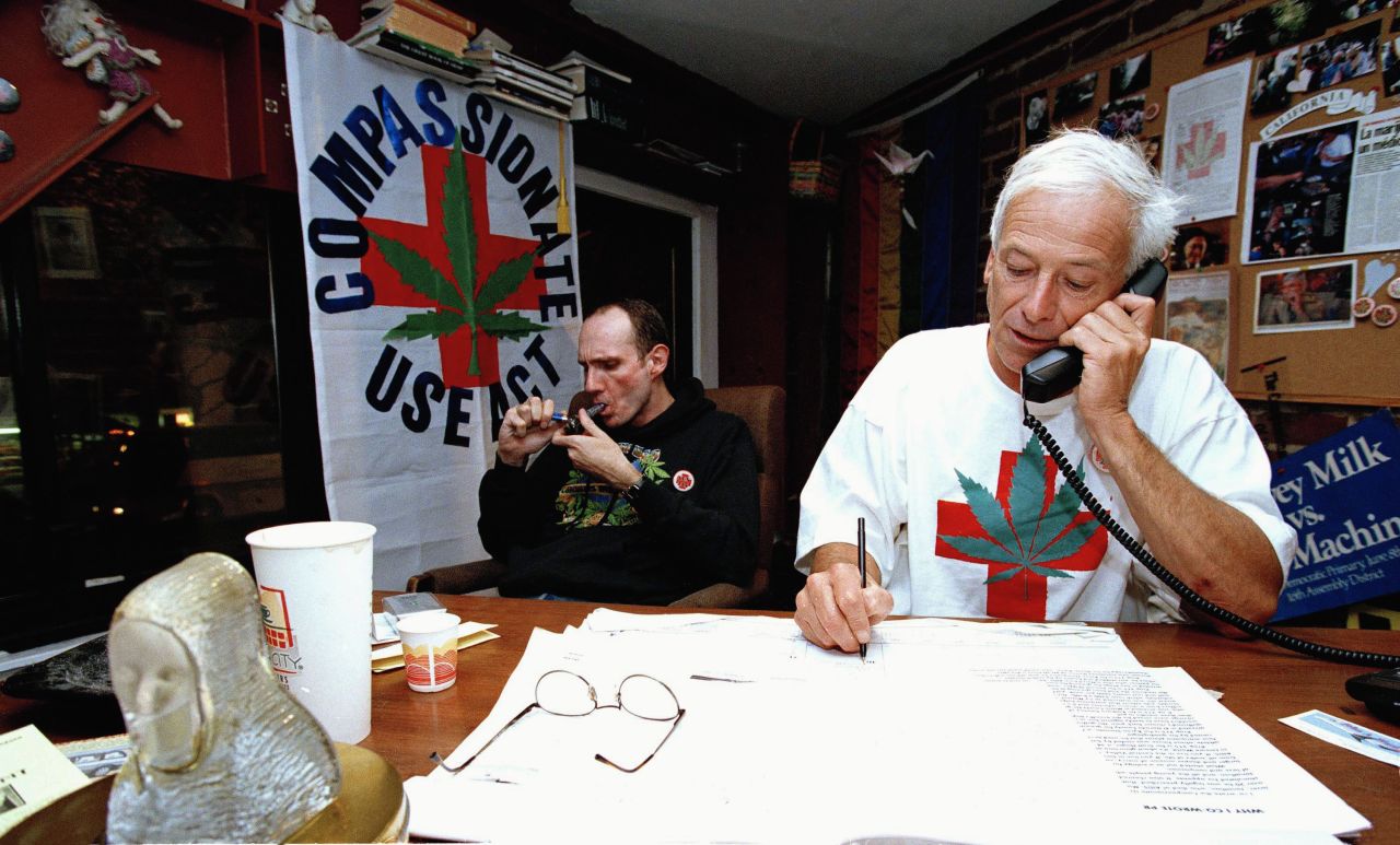Dennis Peron takes notes during a phone interview while Gary Johnson lights up at the Proposition 215 headquarters in San Francisco on October 11, 1996. The ballot measure was approved when voters went to the polls in November, allowing medical marijuana in California.