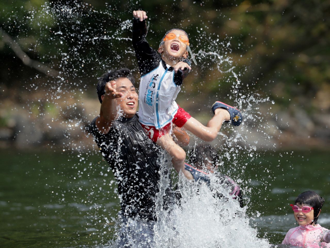 Family members cool off in the river in Shimanto, Japan, on August 14. The temperature reached 41 degrees Celsius (105.8 degrees Fahrenheit) in the city in southern Japan and <a href="http://www.cnn.com/2013/08/13/world/asia/asia-heat/index.html">set a new national record</a>, according to the Japanese Meteorological Agency.