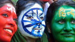 Indian students, their faces painted with the colours of their national flag, pose on the eve of Independence day in Allahabad on August 14, 2013. India celebrates its 66th independence anniversary from British rule on August 15.  