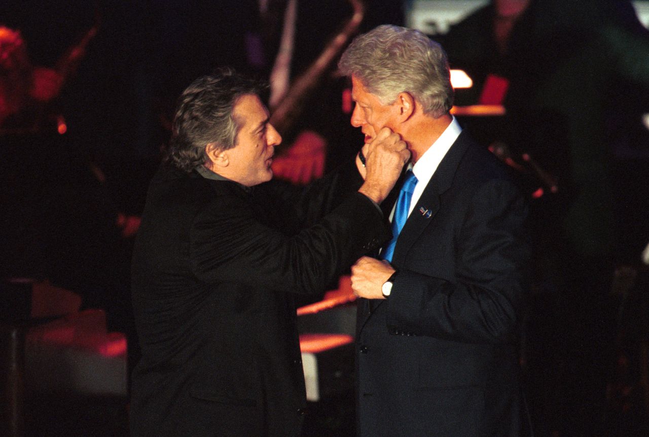President Bill Clinton and De Niro goof around at a fundraiser on Hillary Clinton's birthday at New York's Roseland Ballroom in 2000.