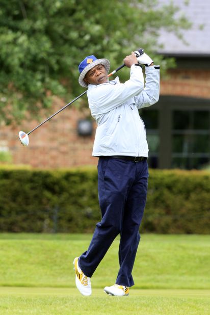 Samuel L. Jackson plays a tee shot during the Shooting Stars charity event at England's The Grove Hotel course in June 2013.