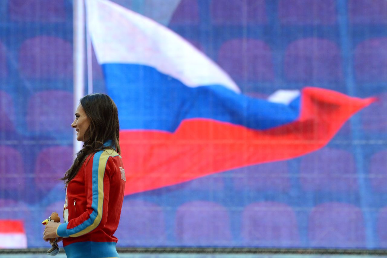 Russian pole vault star Yelena Isinbayeva launched a staunch defense of her country's new anti-gay laws after receiving her gold medal at the World Athletics Championships in Moscow Thursday. 