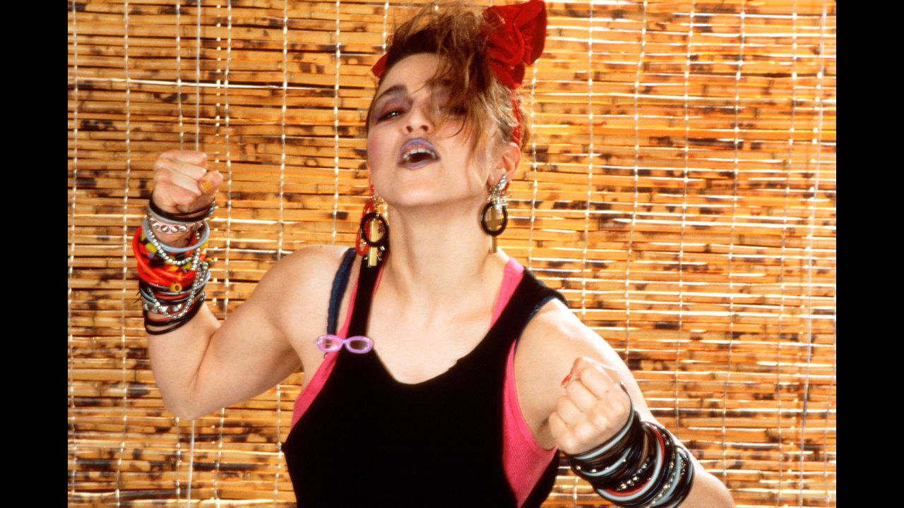 Madonna's look in 1984: layered tops, dark makeup and bracelets, bracelets and more bracelets.