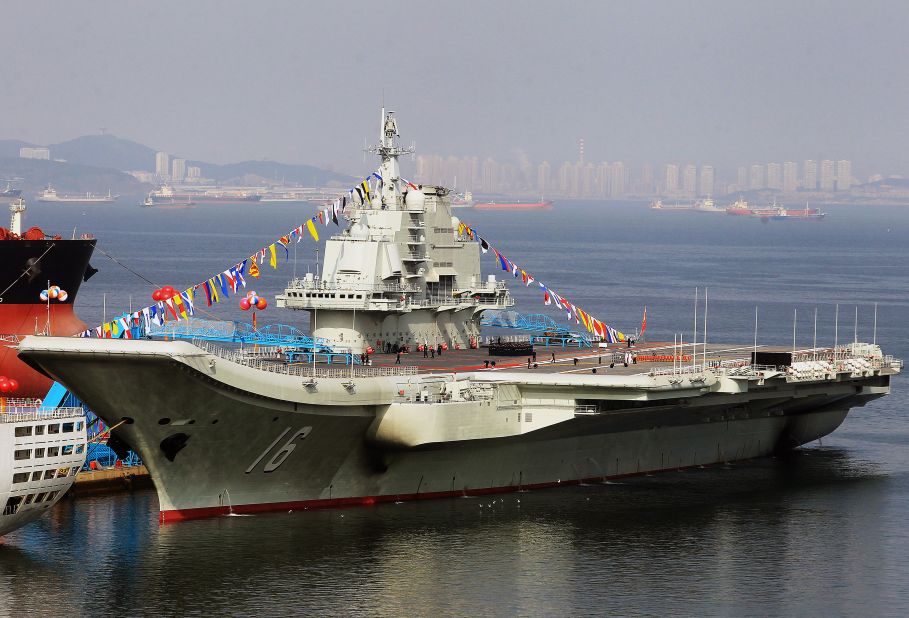 China's first aircraft carrier,  former Soviet carrier  Varyag, docked after its handover to the People's Liberation Army (PLA) navy in Dalian, northeast China's Liaoning province in 2012. China says the aircraft carrier is a training vessel, but analysts say the ship is a valuable asset in its ambition to gain a blue-water navy.