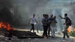 Men carry a wounded man in Cairo, Egypt on August 16, 2013 as clashes break out with police.