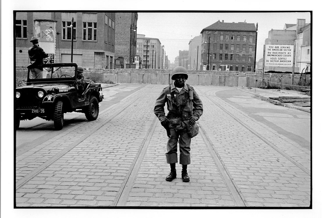 Freed was haunted by this photo he took of a black soldier guarding the Berlin Wall in 1961, author Paul Farber says.