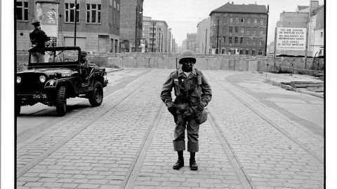 Freed was haunted by this photo he took of a black soldier guarding the Berlin Wall in 1961, author Paul Farber says.
