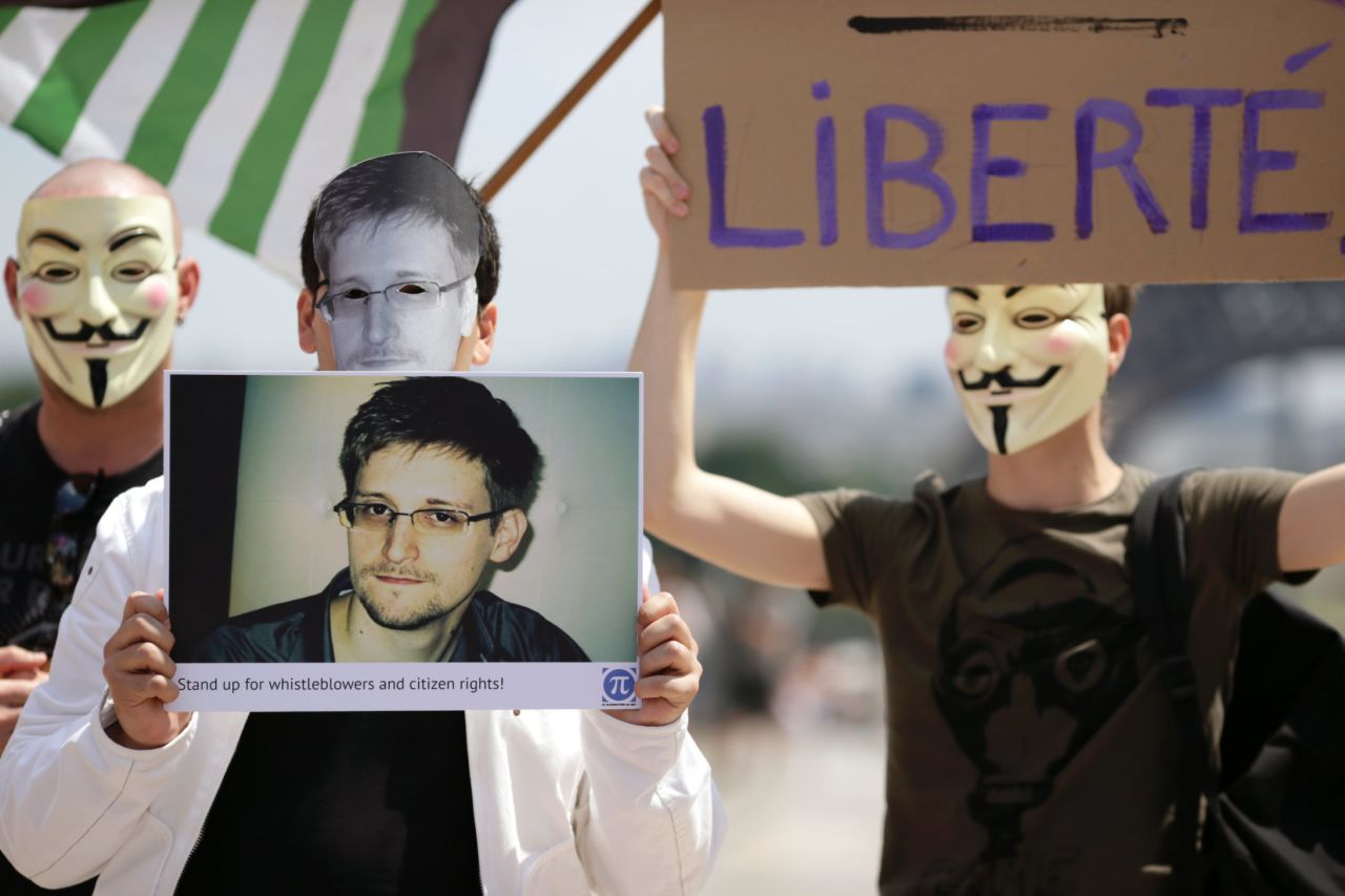 Supporters of Snowden at a demonstration in Paris. "We can't ignore the threat to our civil liberties by giving the government vast powers any more than we can ignore the fact that we live in a dangerous world," says Neil Richards. 