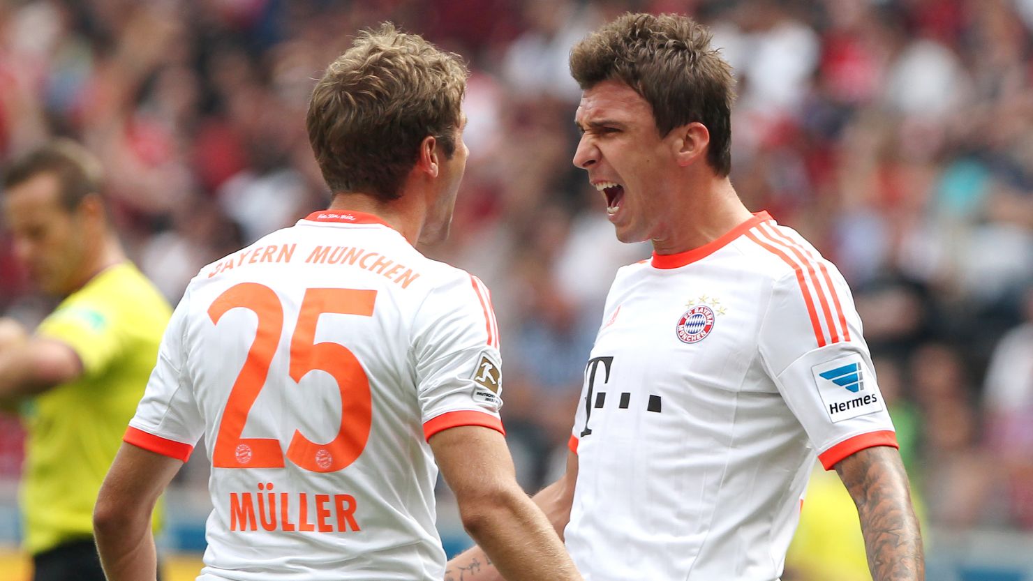 Mario Mandzukic (right) celebrates scoring Bayern Munich's winner against Frankfurt on Saturday.