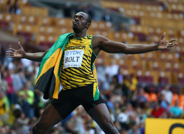 Usain Bolt celebrates after claiming his third 200m world title on Saturday. 