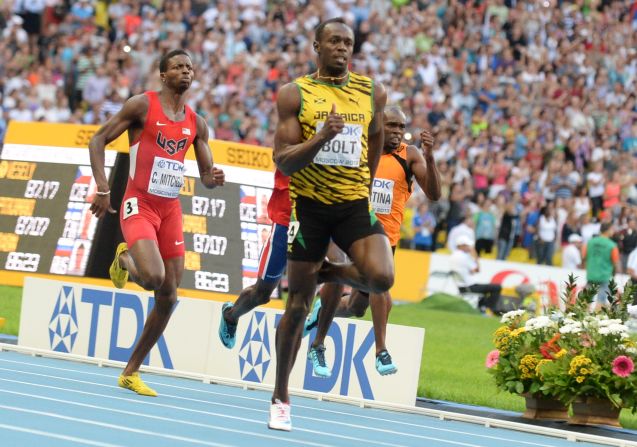 Usain Bolt powers ahead of the field in the 200m final in Moscow. Compatriot Warren Weir took the silver and Curtis Mitchell (left) of the U.S. took bronze. 