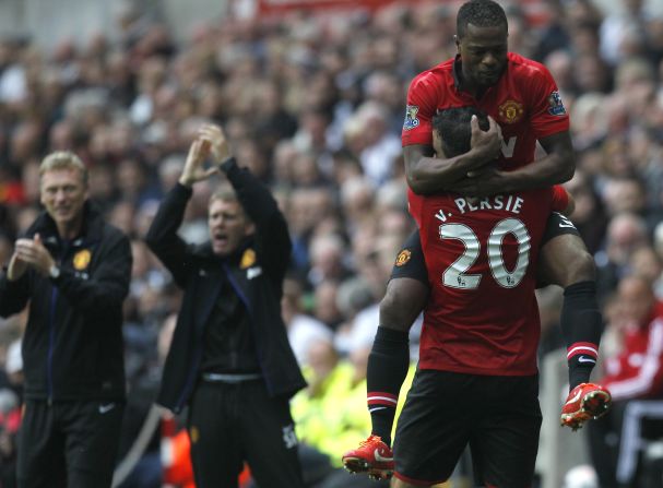 New Man Utd boss David Moyes (left) applauds Robin van Persie after the Dutch striker's second goal against Swansea City on Saturday. Van Persie and Danny Welbeck both scored twice in a 4-1 win.   