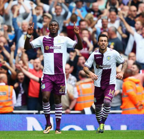 Aston Villa's Christian Benteke celebrates scoring his second goal from the penalty spot. Teammate Antonio Luna (right) scored a late third to send Arsenal crashing to an opening day 3-1 defeat at the Emirates.  
