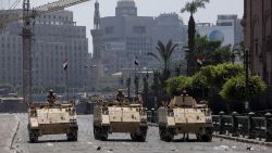 Egyptian military armored vehicles stand guard at a checkpoint on the edge of Tahrir Square by the Egyptian Museum on August 16, 2013 in Cairo, Egypt. 